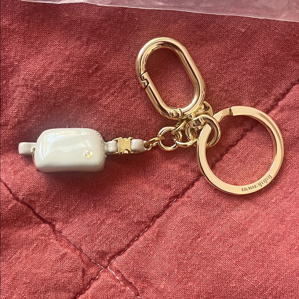 Lululemon Athletica Gold and Cream Key Holder
